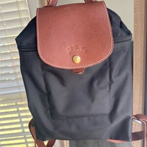 Longchamp Le Pliage black nylon backpack.